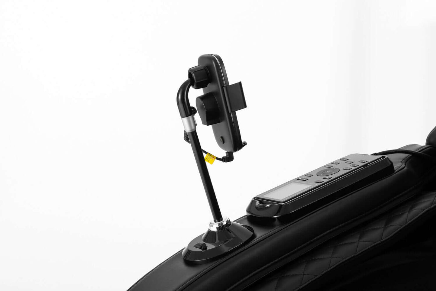 Close-up of the TRU Majestic 4D Massage Chair remote holder attached to the arm for easy access.