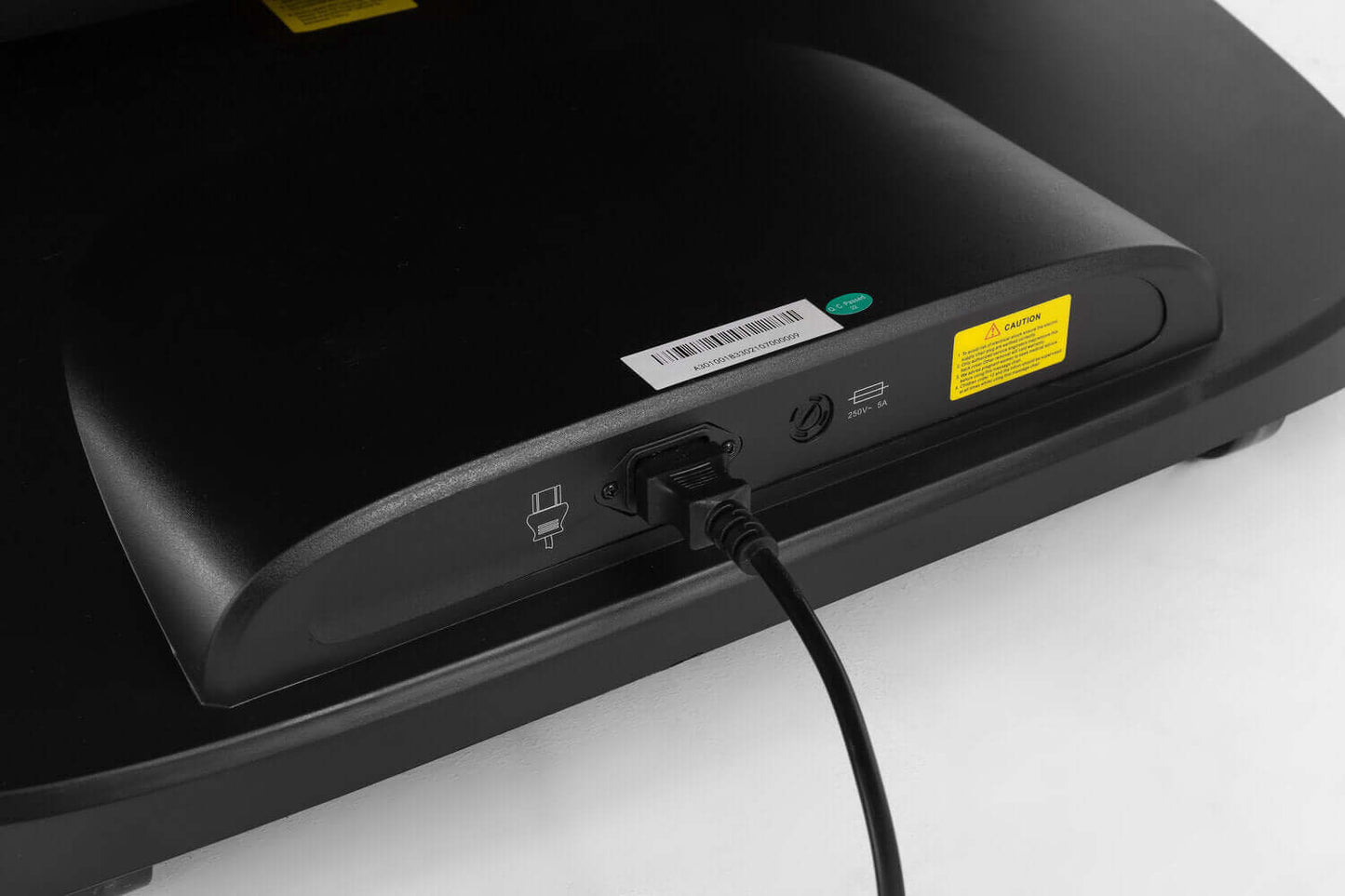 Close-up of the TRU Majestic 4D Massage Chair's power connection port, showcasing cable attachment.